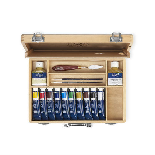Set olio: un cavalletto - 2 tele misto e 1 puro cotone - 8 pennelli - cassetta olio - 2 manuali